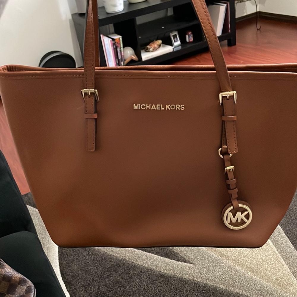 Michael Kors bag and really good condition. I do not have the dust bag anymore.